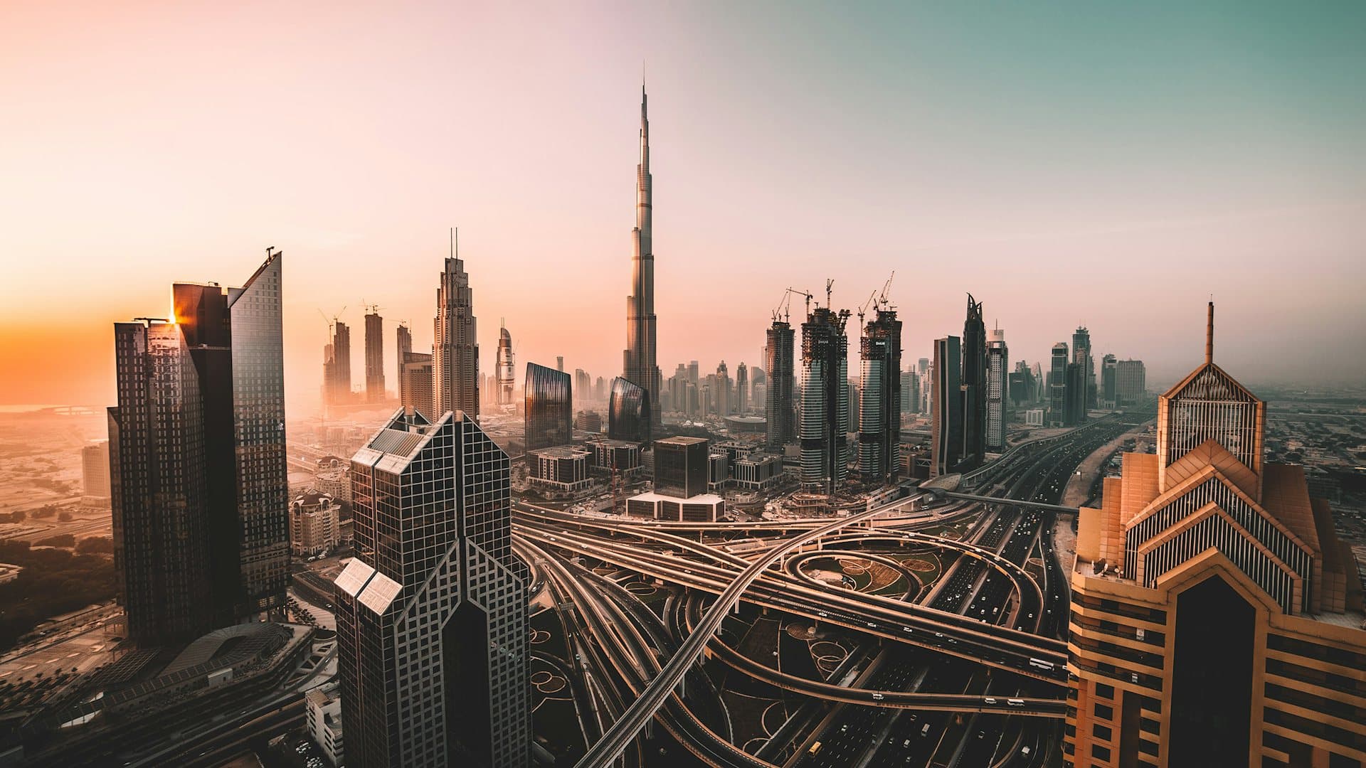 Dubai city skyline at sunrise with the Burj Khalifa