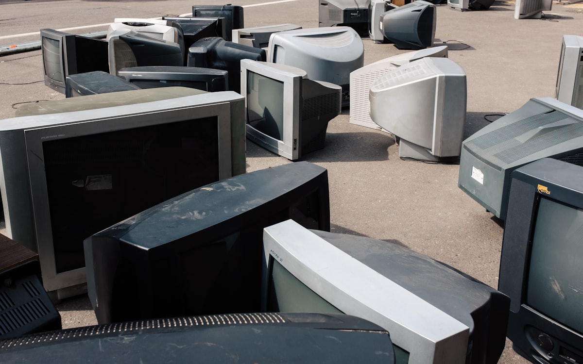 Old televisions set out for electronics disposal and e-waste removal Dubai