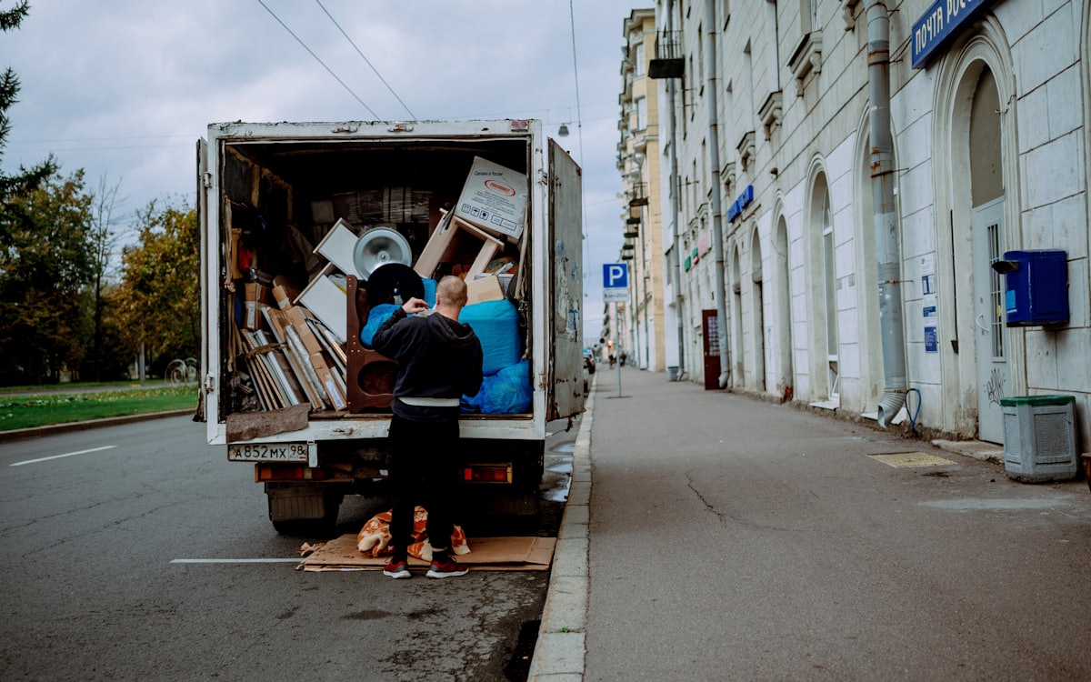 Furniture removal Dubai crew unloading furniture from a moving truck