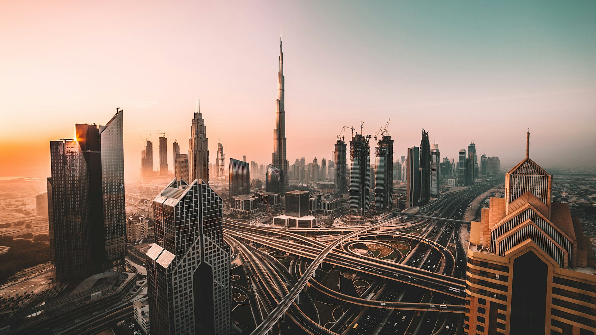 Dubai city skyline at sunrise, seen from above Sheikh Zayed Road